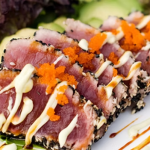 Sesame‑crusted ahi tuna plated for gourmet catering in Miami by Rivera Events