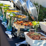Hot buffet catering with meats and roasted vegetables in Miami by Rivera Events